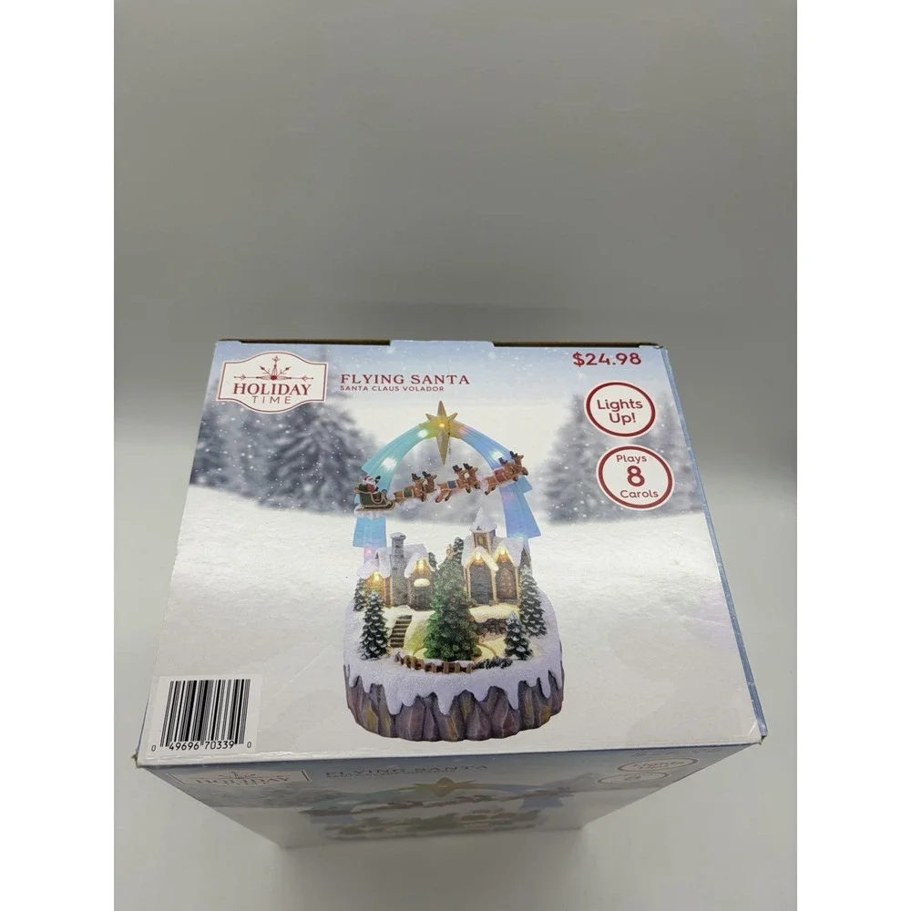 NIB 2024 Holiday Time Christmas Flying Santa Village Light Up & Plays 8 Carols